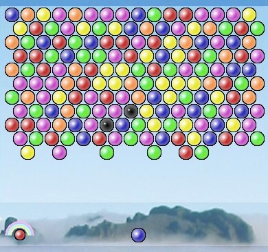An image of the puzzle game Frozen Bubble online, featuring a multicolored grid of bubbles. A single bubble is ready to be launched from the bottom center, with a rainbow gauge on the bottom left indicating the number of shots left before the grid descends. 
